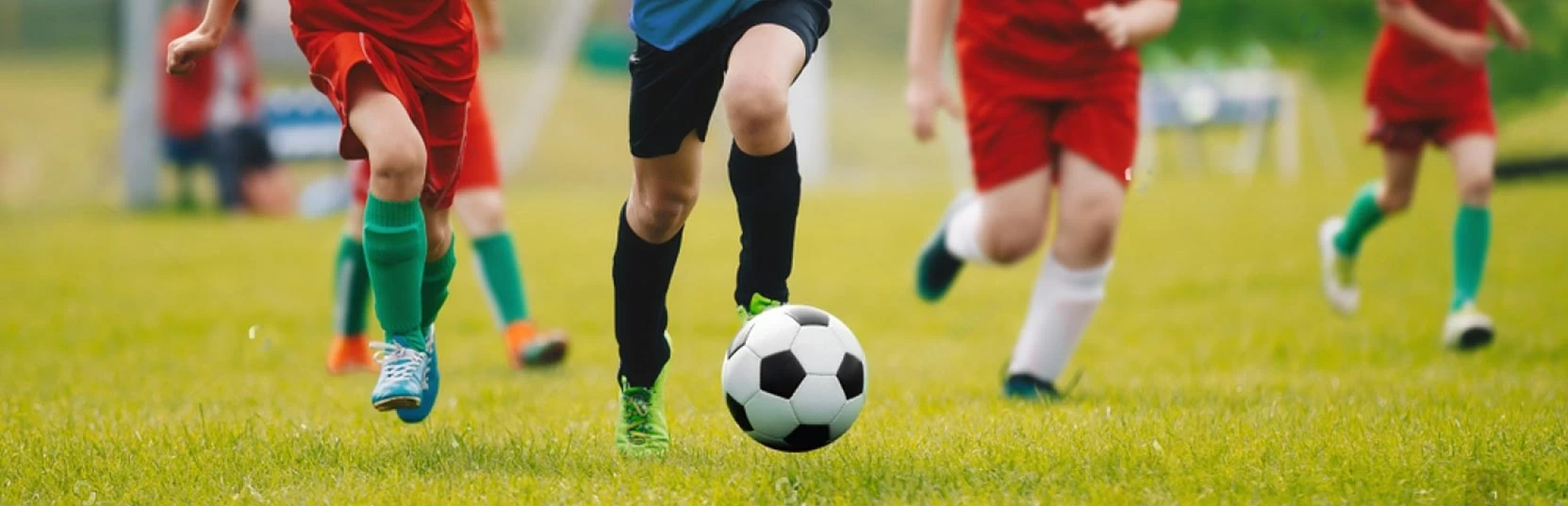 20230725141941_stock-photo-running-soccer-football-players-footballers-kicking-football-match-soccer-school-tournament-1167703315